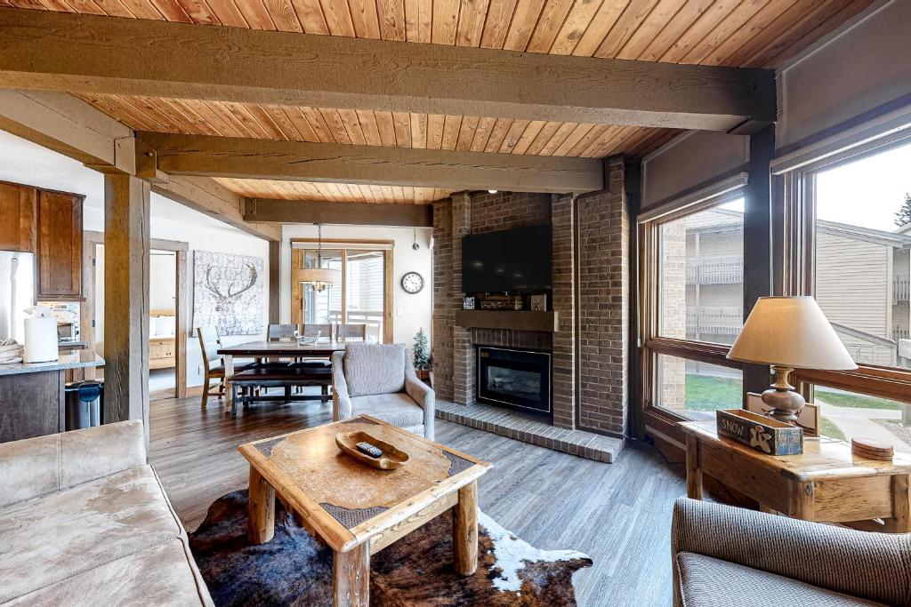 a living room with a couch and a table at Lodge at Steamboat D101 in Steamboat Springs