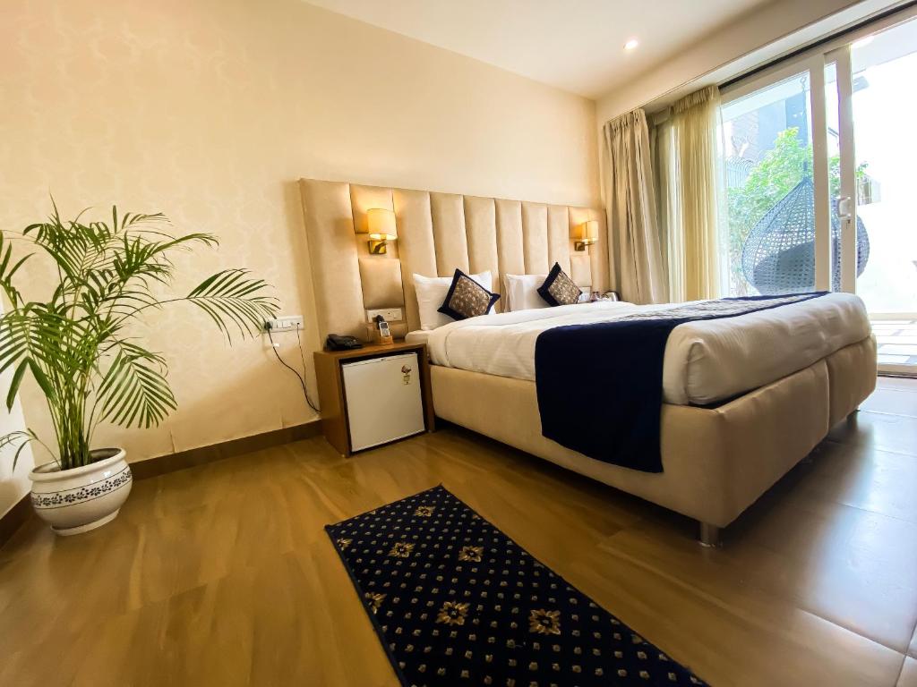 Postel nebo postele na pokoji v ubytování Sky Suites