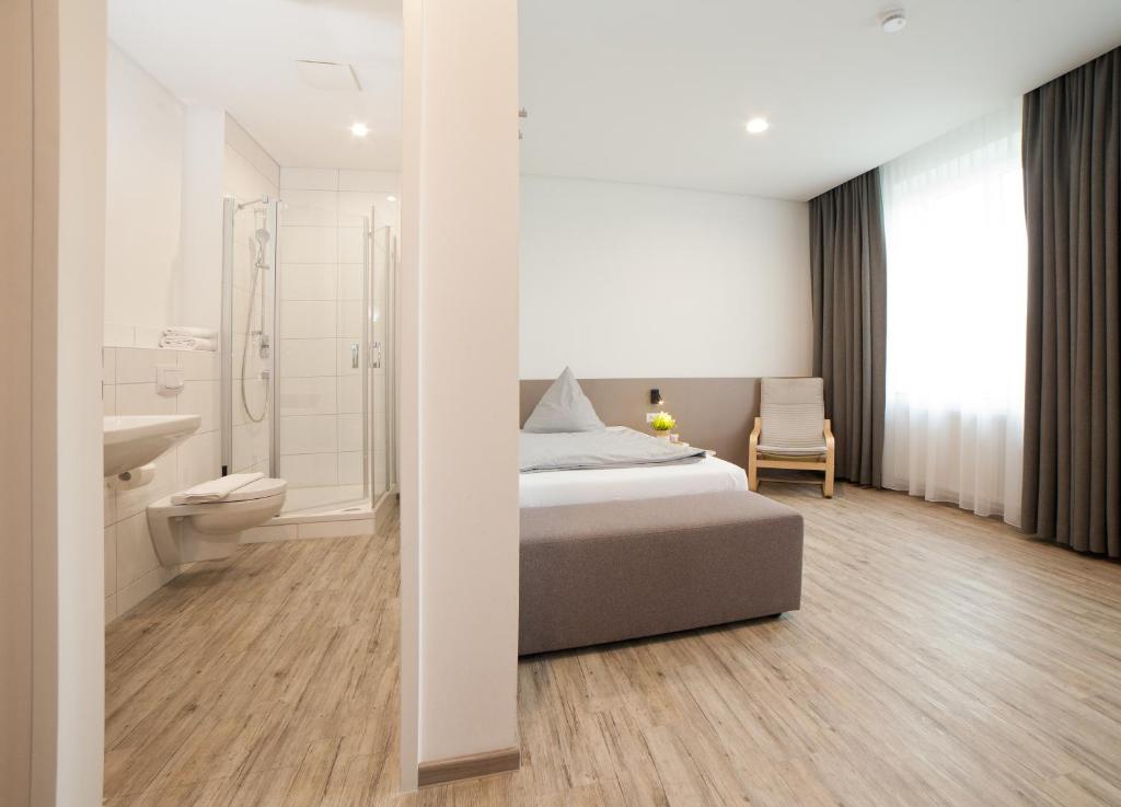 Postel nebo postele na pokoji v ubytování boardinghouse Main-Tauber