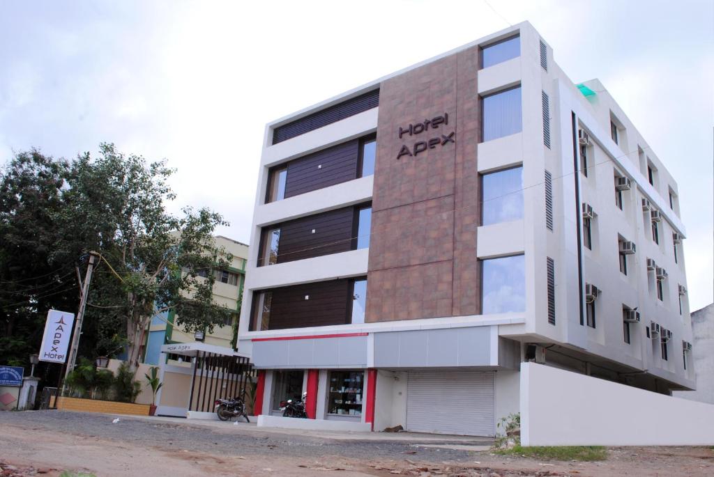 an apartment building with the words happy apex on it at Hotel New Apex locals and UMC not allowed in Ankleshwar