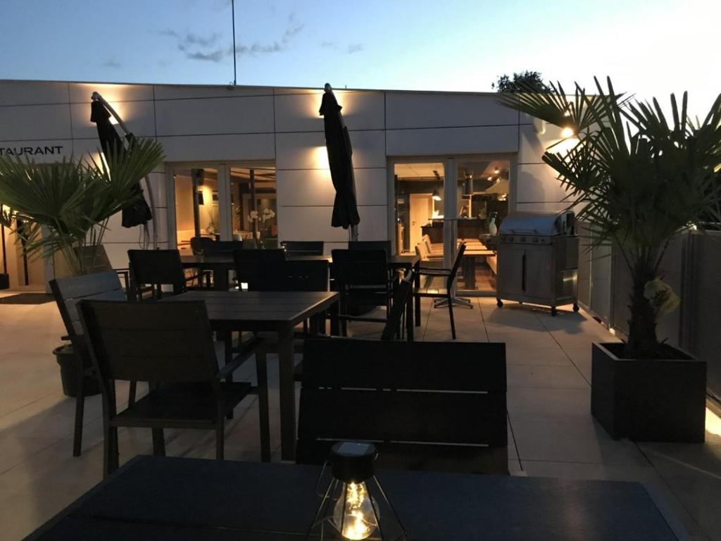 A patio or other outdoor area at Primma Hotel
