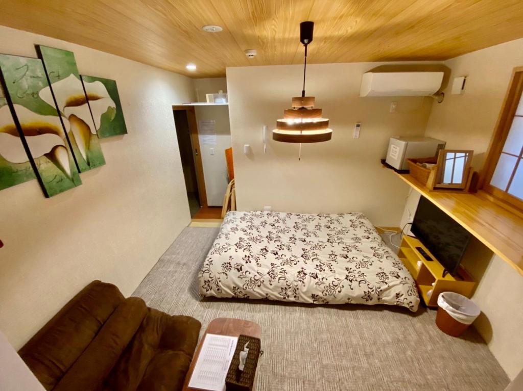 Postel nebo postele na pokoji v ubytování Hotel EL Shinjuku 6