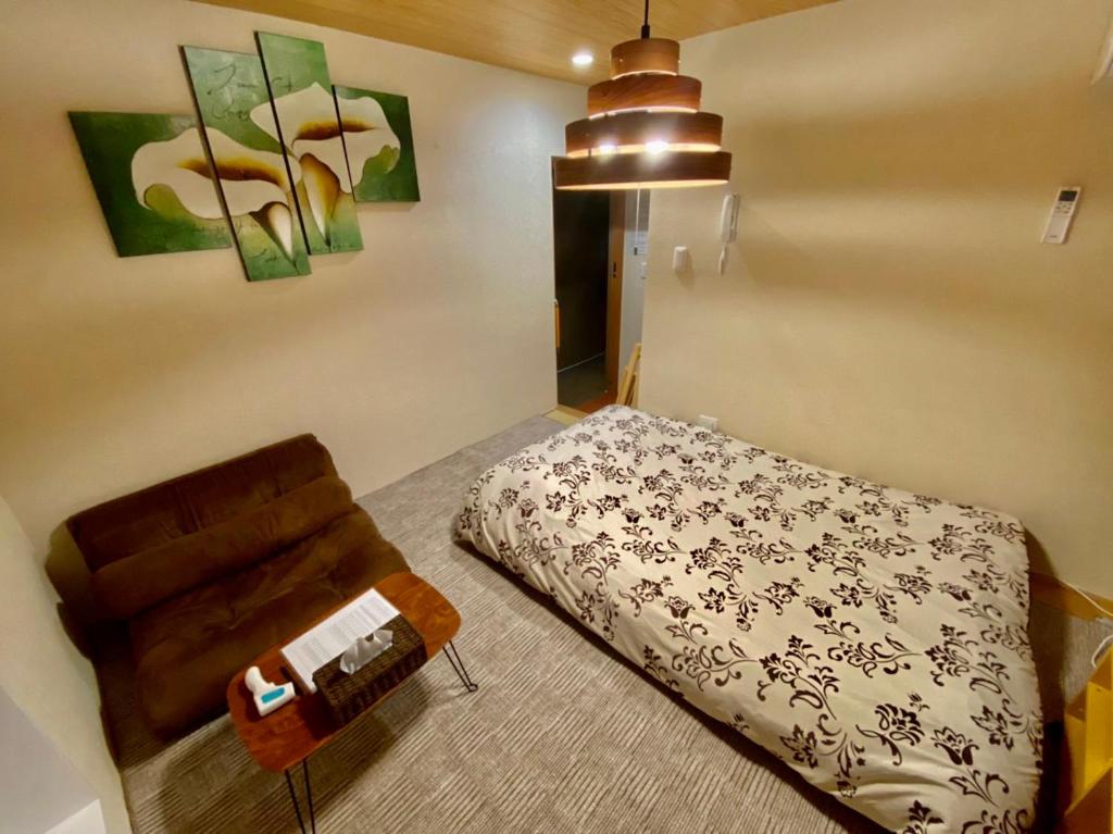 Postel nebo postele na pokoji v ubytování Hotel EL Shinjuku 6