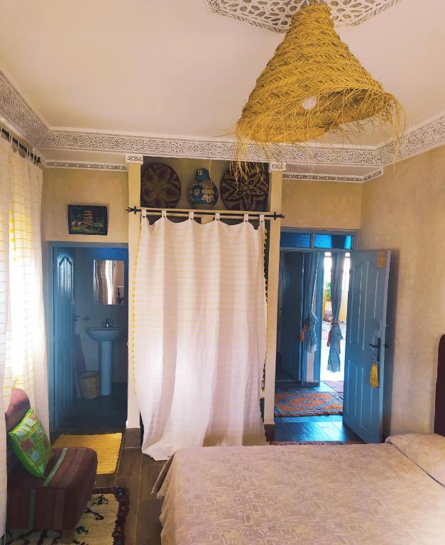 Postel nebo postele na pokoji v ubytování Le petit Jardin
