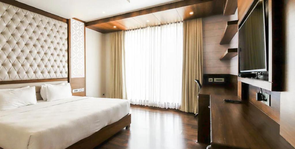 Postel nebo postele na pokoji v ubytování Hotel Preethi International
