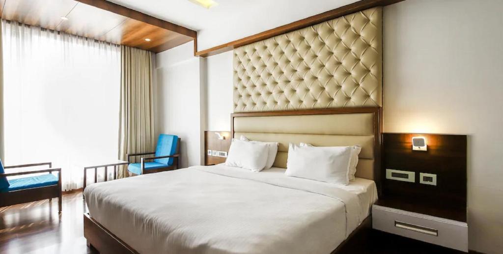Postel nebo postele na pokoji v ubytování Hotel Preethi International