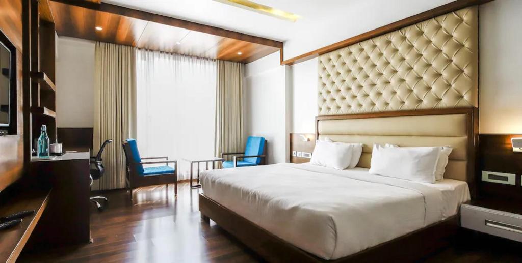 Postel nebo postele na pokoji v ubytování Hotel Preethi International