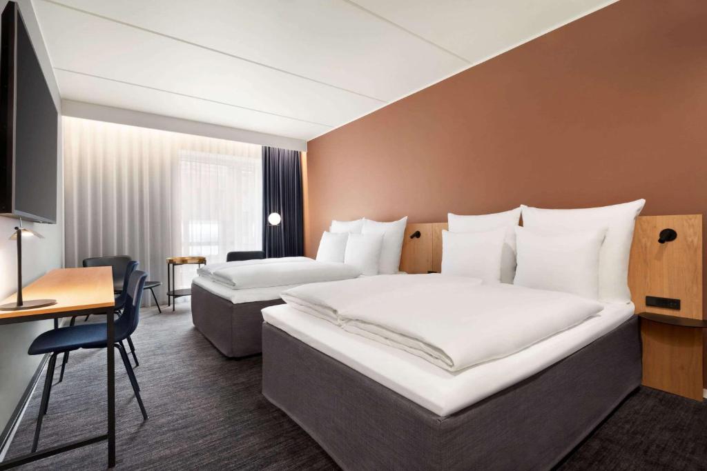 Postel nebo postele na pokoji v ubytování Comwell Copenhagen Portside Dolce by Wyndham
