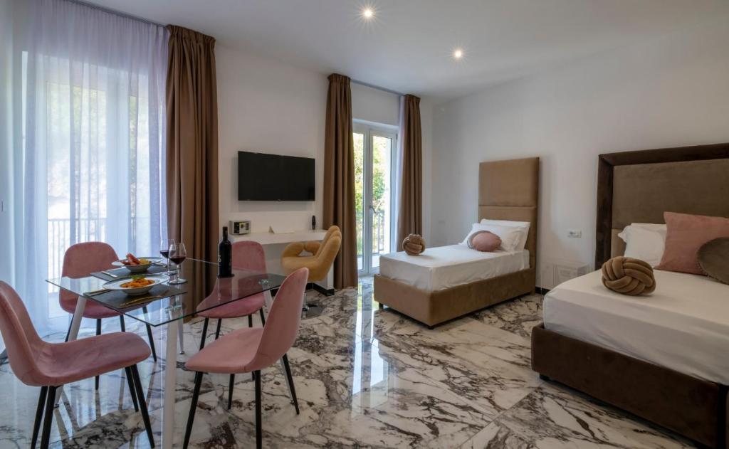 Postel nebo postele na pokoji v ubytování GRAND HOTEL SERAPIDE