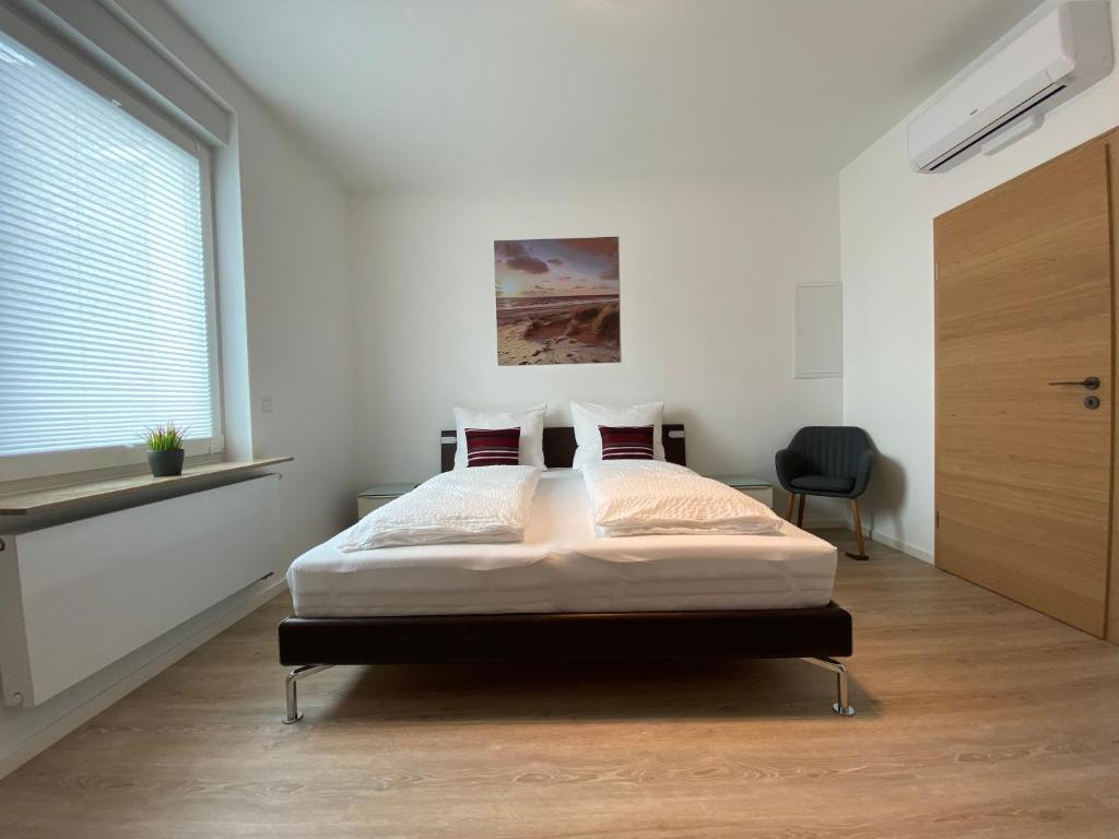 Postel nebo postele na pokoji v ubytování Modern Home Check-in & chill down auf 65 qm²
