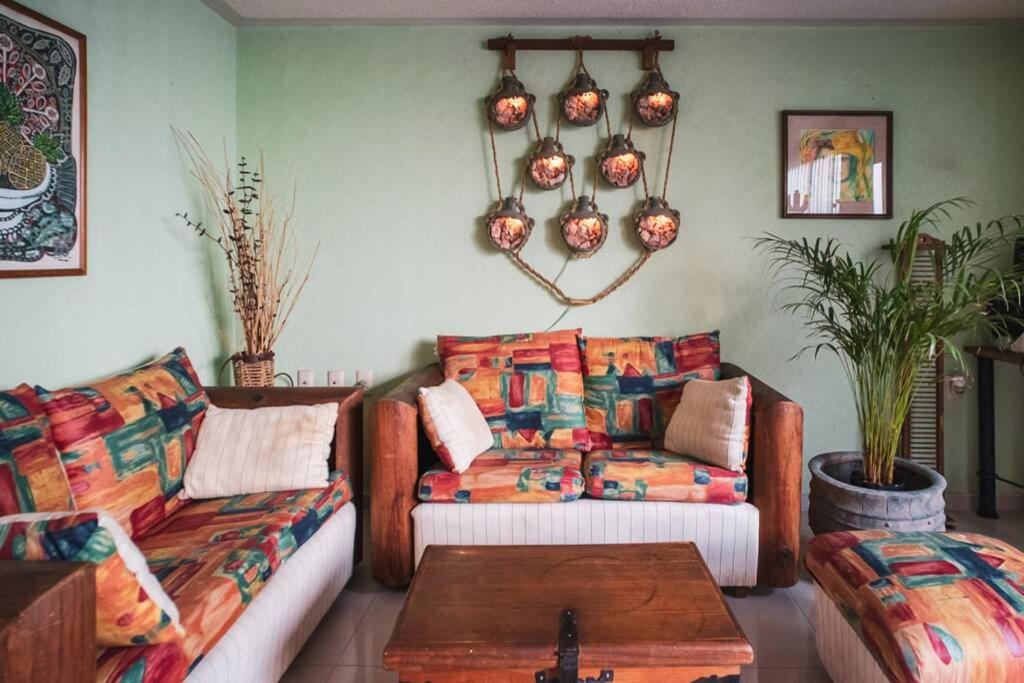 a living room with a couch and a table at Rincón de Checo in Mexico City