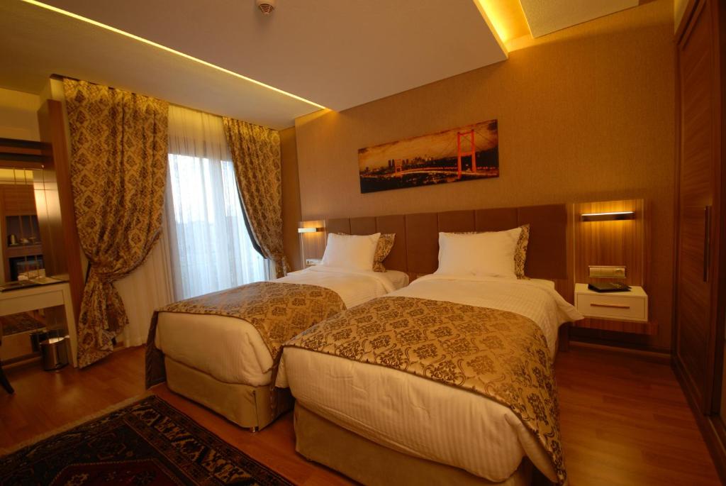 Postel nebo postele na pokoji v ubytování Imamoglu Pasa Butik Hotel