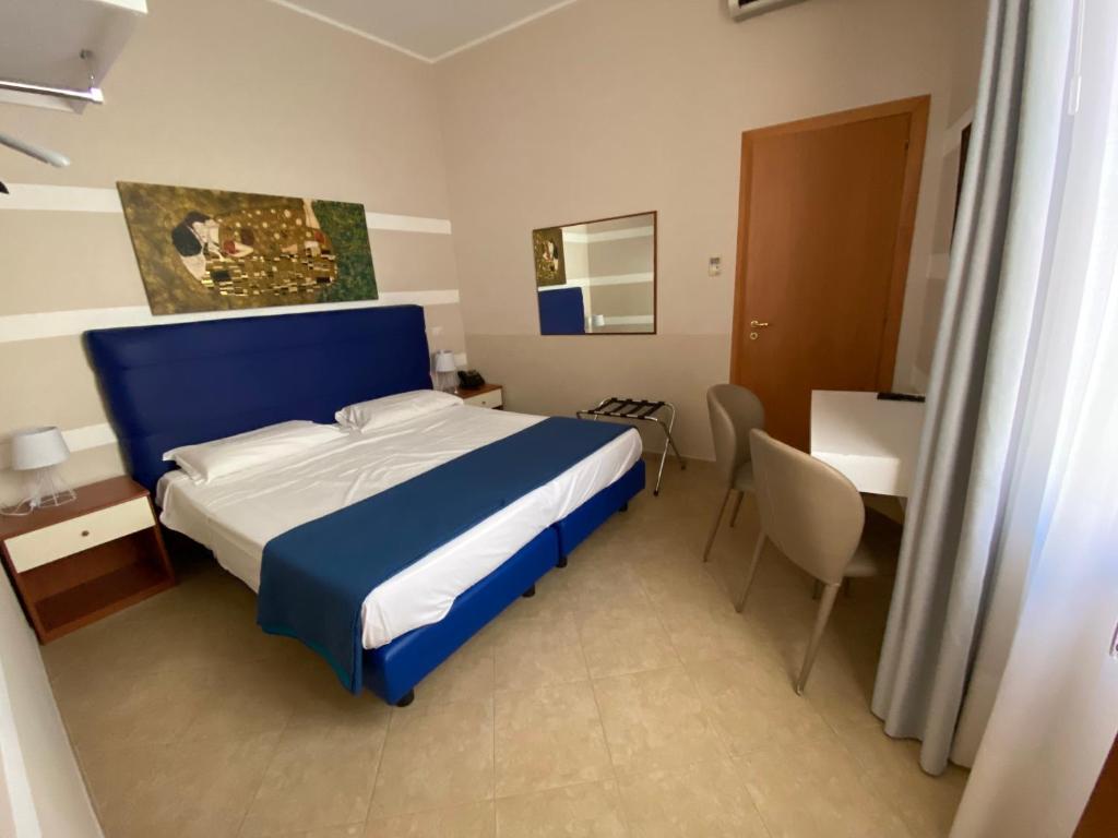 Postel nebo postele na pokoji v ubytování Albergo Ristorante del Cacciatore