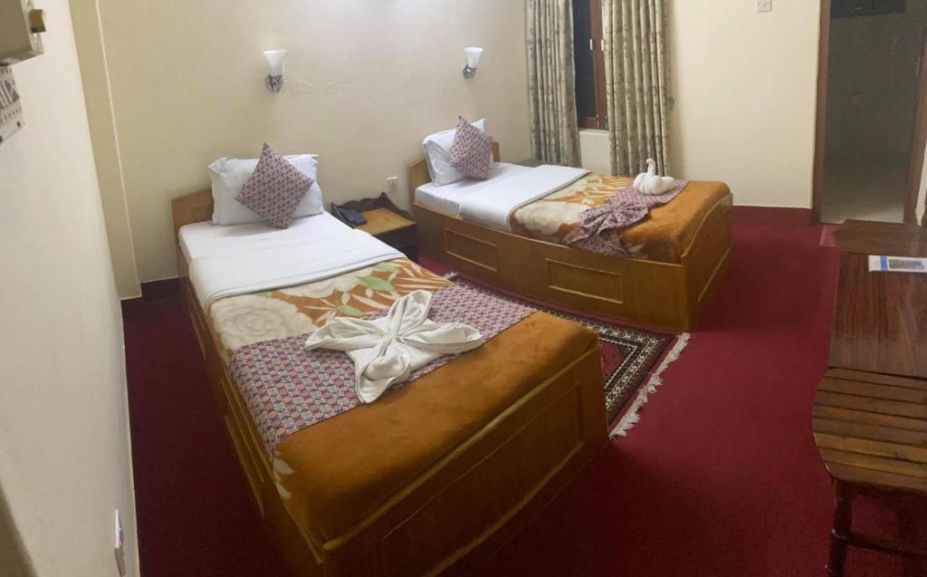 Postel nebo postele na pokoji v ubytování Hotel Blue Magnet