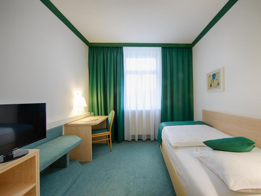 Voodi või voodid majutusasutuse Hotel Kaiserin Augusta toas