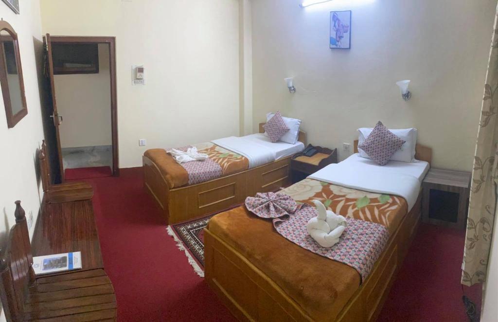 Postel nebo postele na pokoji v ubytování Hotel Blue Magnet