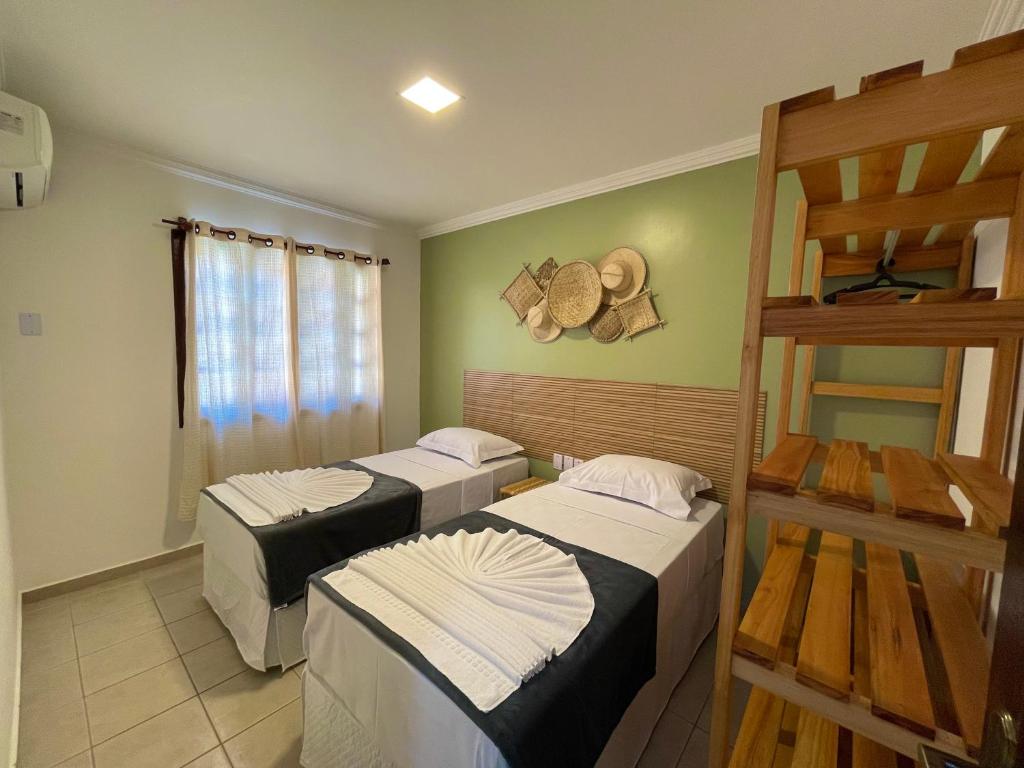 Postel nebo postele na pokoji v ubytování MUTA PRAIA HOTEL