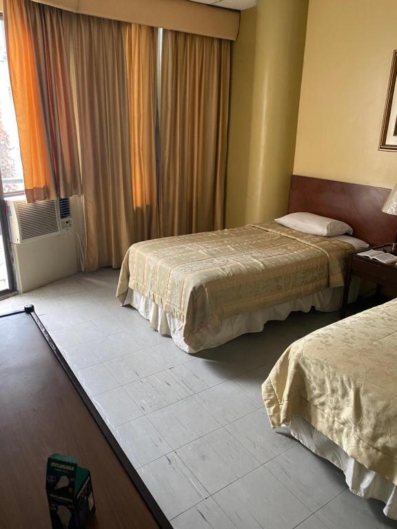 Postel nebo postele na pokoji v ubytování Hotel Rizzo