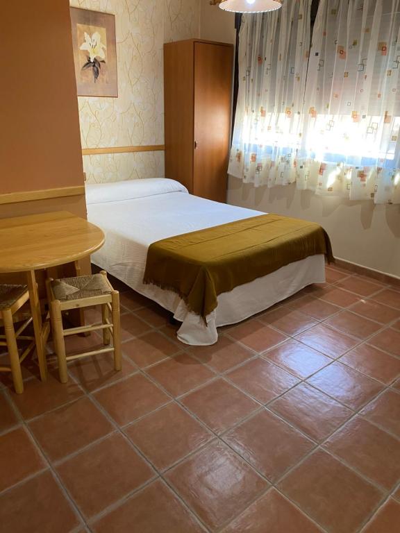 Postel nebo postele na pokoji v ubytování Apartamentos Rurales "La Fuentecilla"