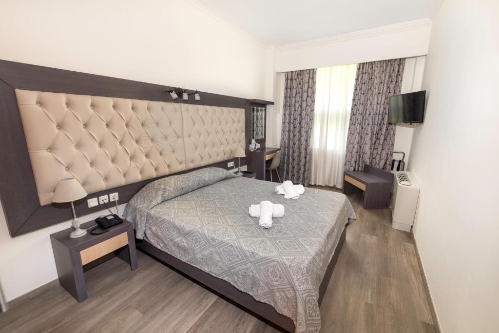 Posteľ alebo postele v izbe v ubytovaní Famissi Eden Hotel