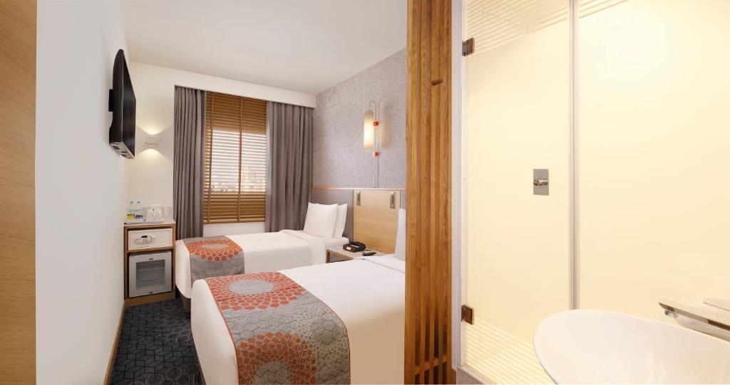 Postel nebo postele na pokoji v ubytování Holiday Inn Express Chennai OMR Thoraipakkam by IHG