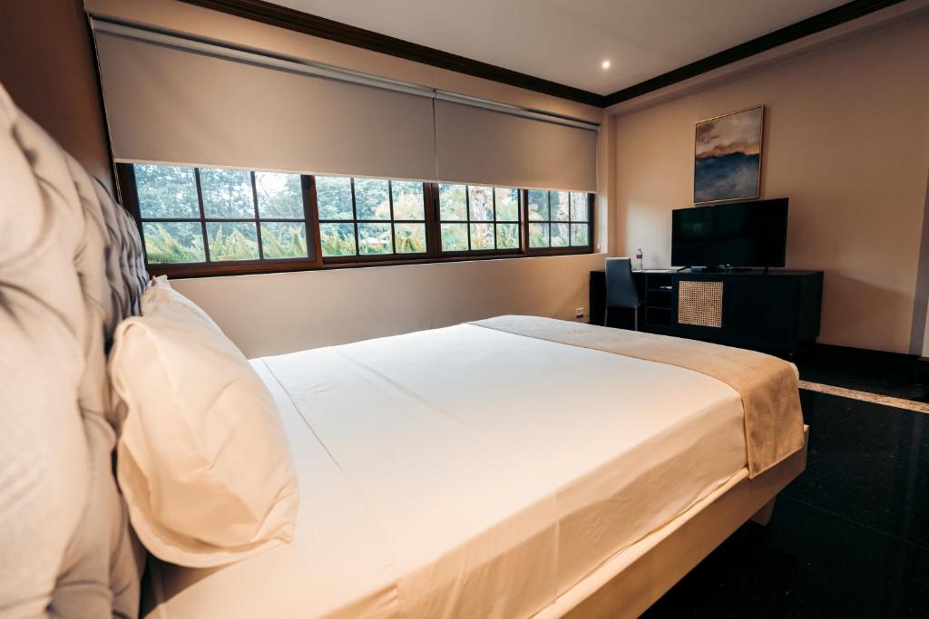 Postel nebo postele na pokoji v ubytování Luxva Hotel Boutique