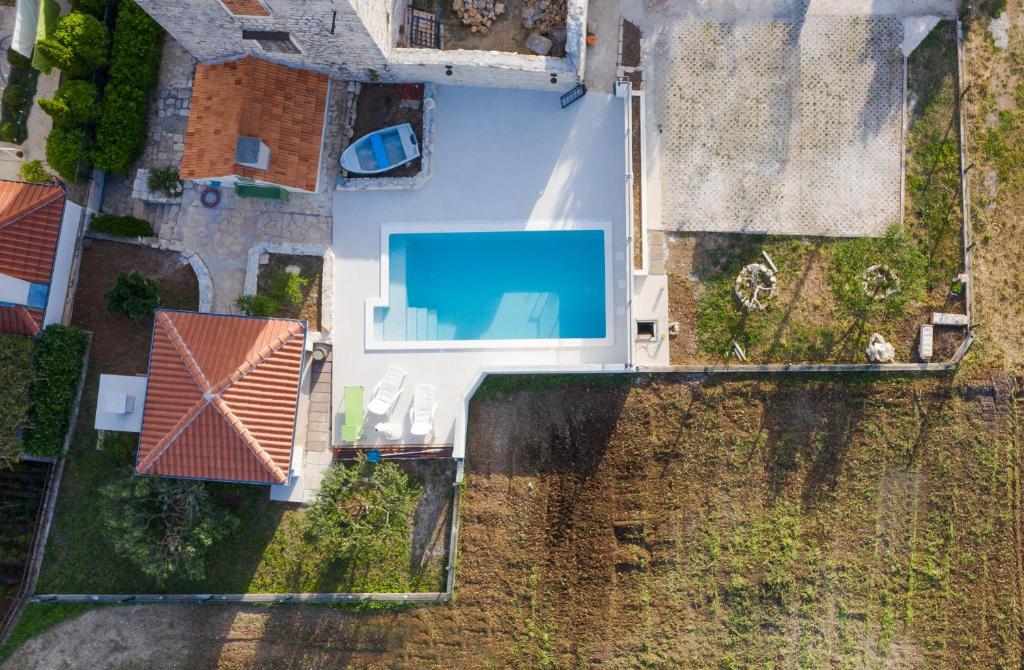 an overhead view of a house with a swimming pool at House Mia in Trogir