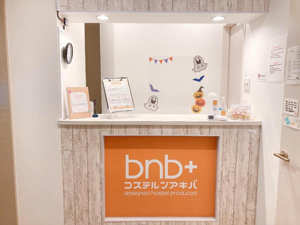 a display case in a hospital with a sign at bnb+ Akihabara (Female Only) in Tokyo