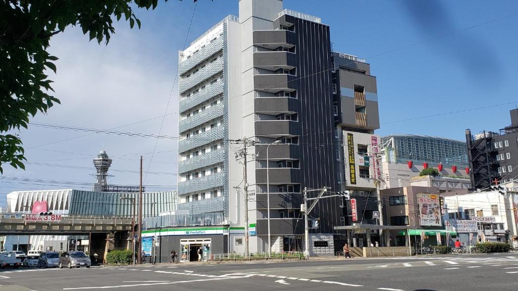 a tall building on the side of a city street at Hotel Chuo Crown in Osaka