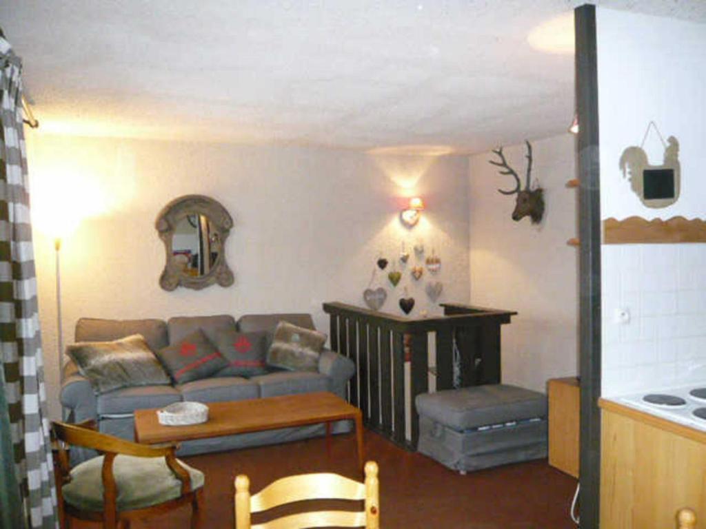 a living room with a couch and a table at Appartement Villard-de-Lans, 3 pièces, 6 personnes - FR-1-515-9 in Villard-de-Lans