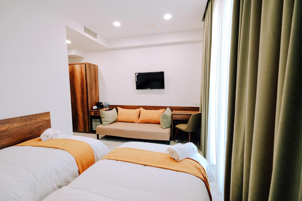Postel nebo postele na pokoji v ubytování Hotel Doesi