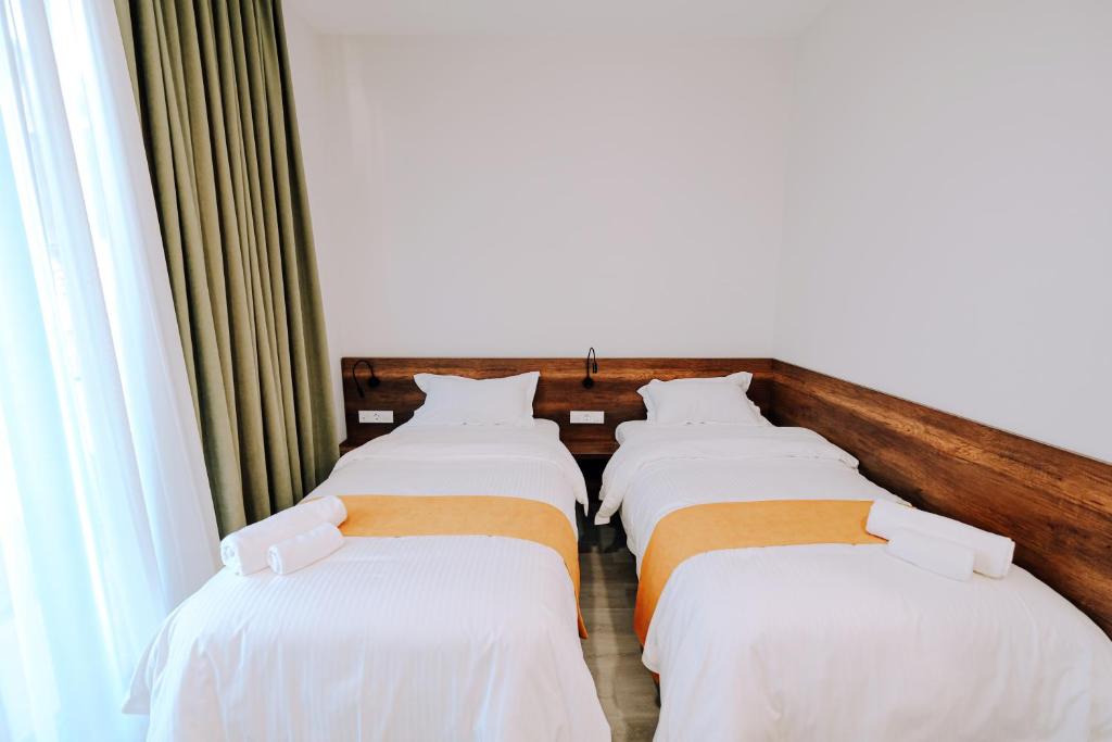 Postel nebo postele na pokoji v ubytování Hotel Doesi
