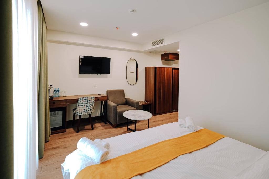 Postel nebo postele na pokoji v ubytování Hotel Doesi
