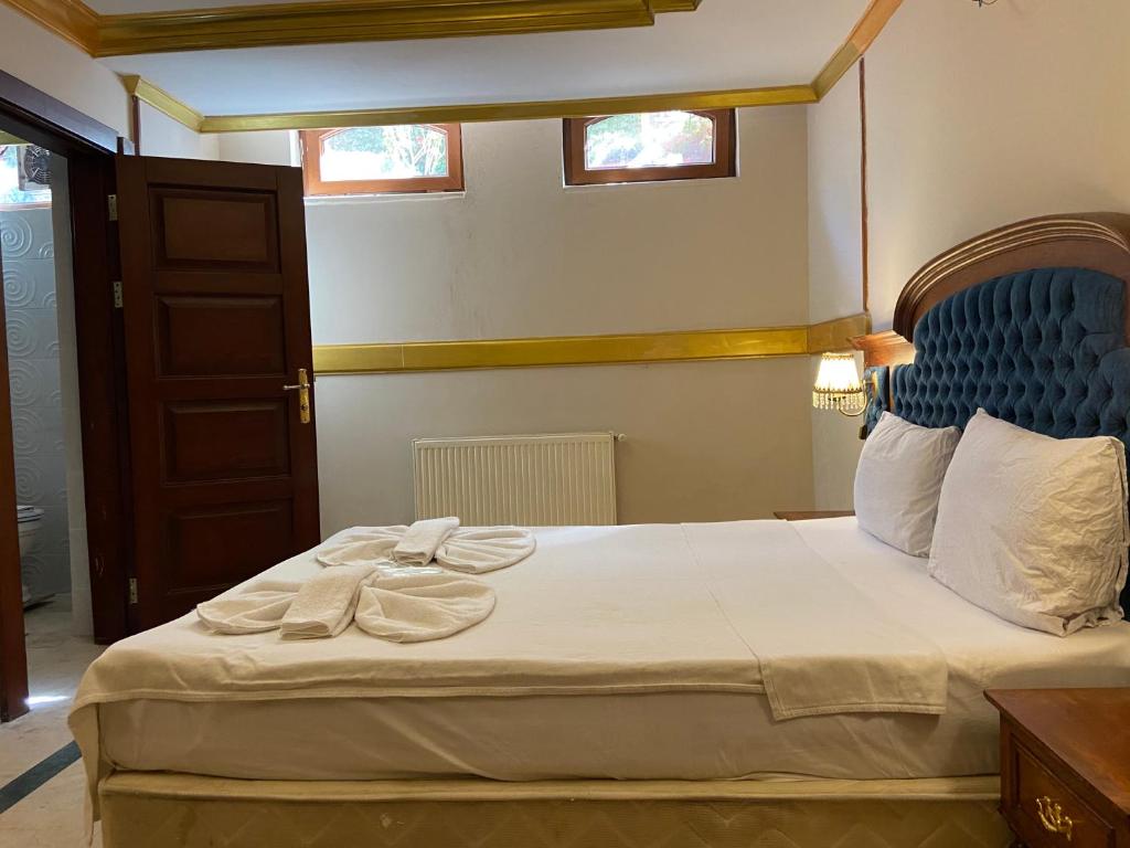 Postel nebo postele na pokoji v ubytování Aruna Boutique Hotel