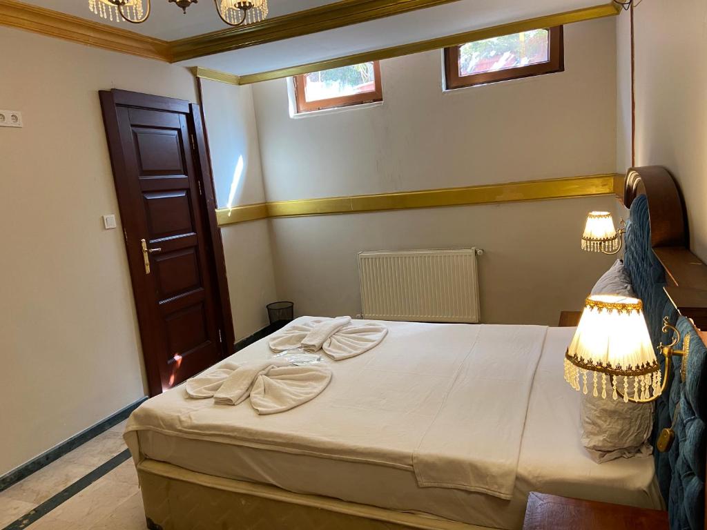 Postel nebo postele na pokoji v ubytování Aruna Boutique Hotel