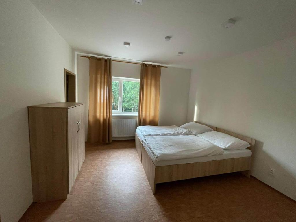 Postel nebo postele na pokoji v ubytování Sport resort Nenudimse