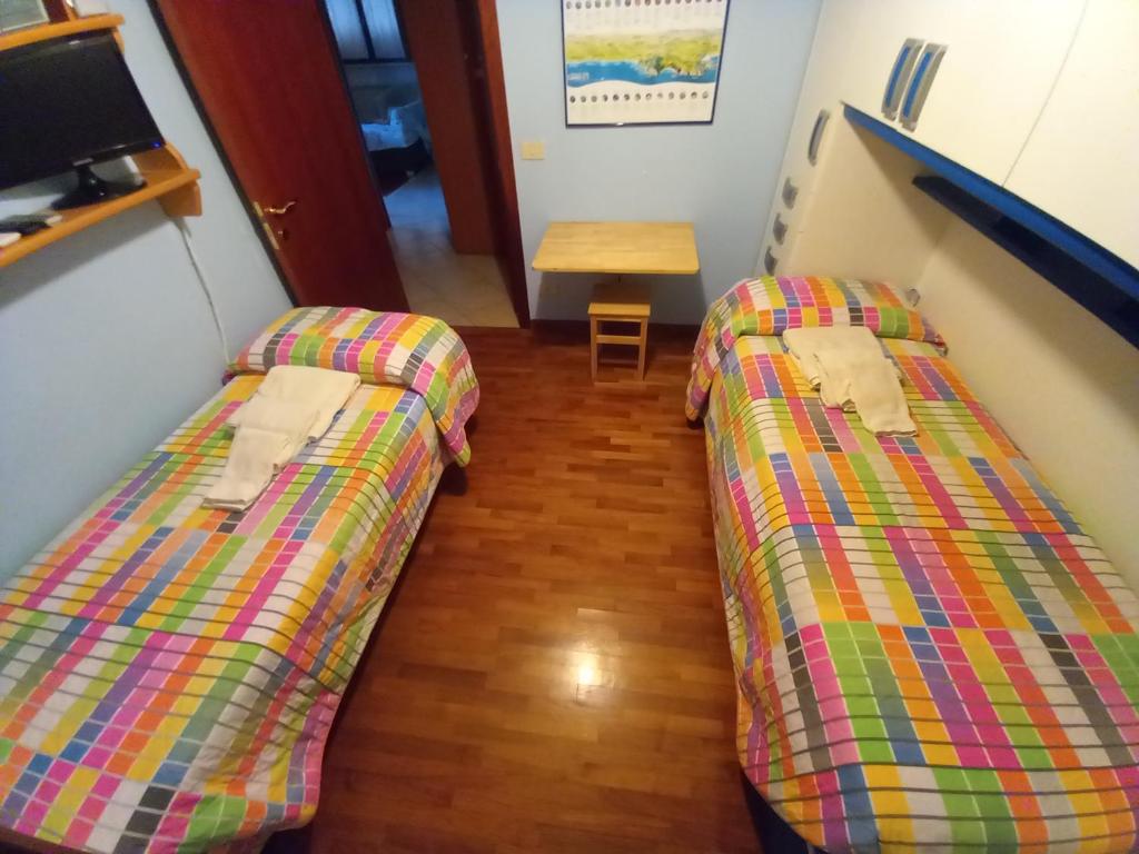 A bed or beds in a room at Villetta con giardino e parcheggio coperto