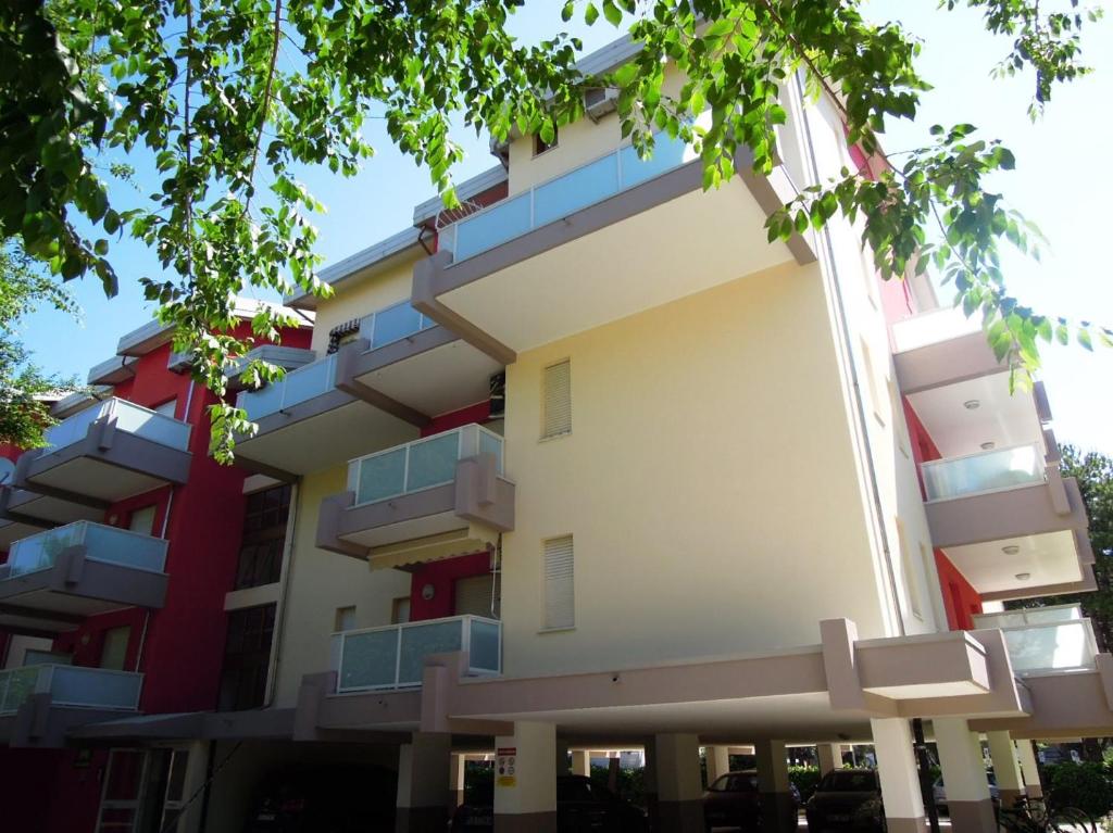 a building with balconies on the side of it at Condominio Marina Piccola in Bibione