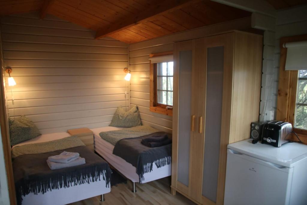 Postel nebo postele na pokoji v ubytování Skógarkot Cottage
