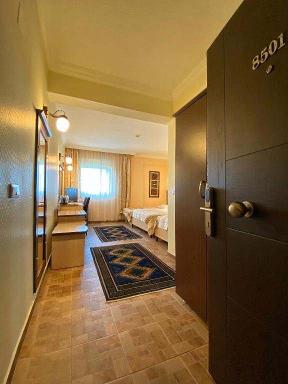 Postel nebo postele na pokoji v ubytování Monark Hotel Cappadocia
