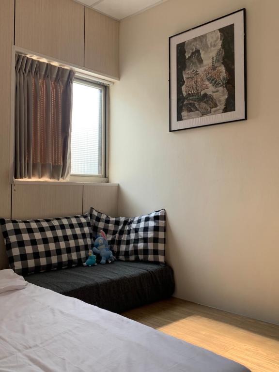 Postel nebo postele na pokoji v ubytování Guan Ma Homestay