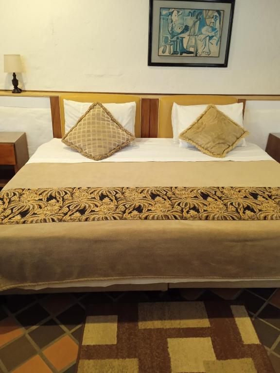Postel nebo postele na pokoji v ubytování HOTEL LA POSADA DEL ZAGUÁN