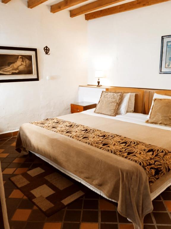 Postel nebo postele na pokoji v ubytování HOTEL LA POSADA DEL ZAGUÁN
