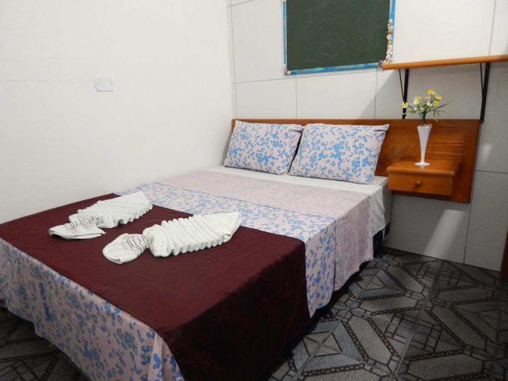 Postel nebo postele na pokoji v ubytování Praia Hostel