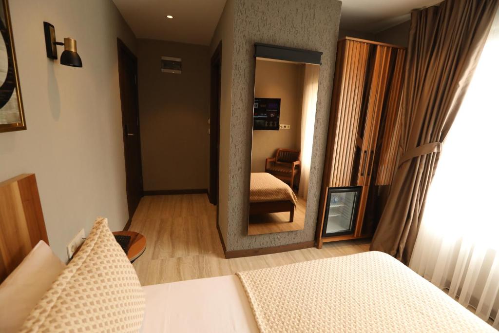 Postel nebo postele na pokoji v ubytování Villa Siesta Hotel Istanbul Airport