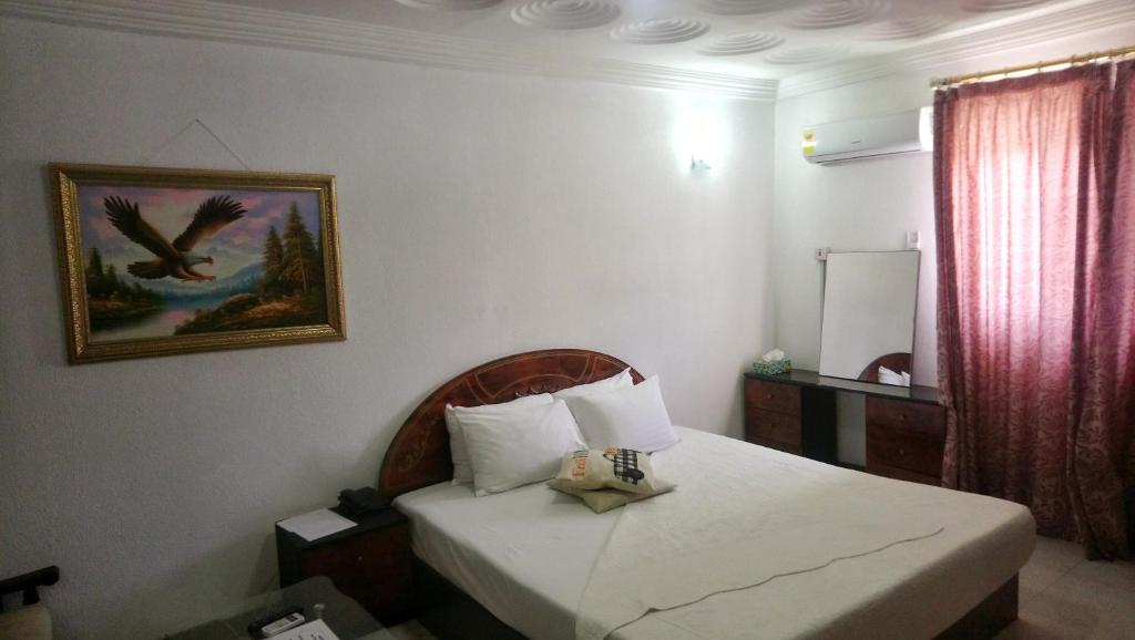מיטה או מיטות בחדר ב-Eastoment Hotel