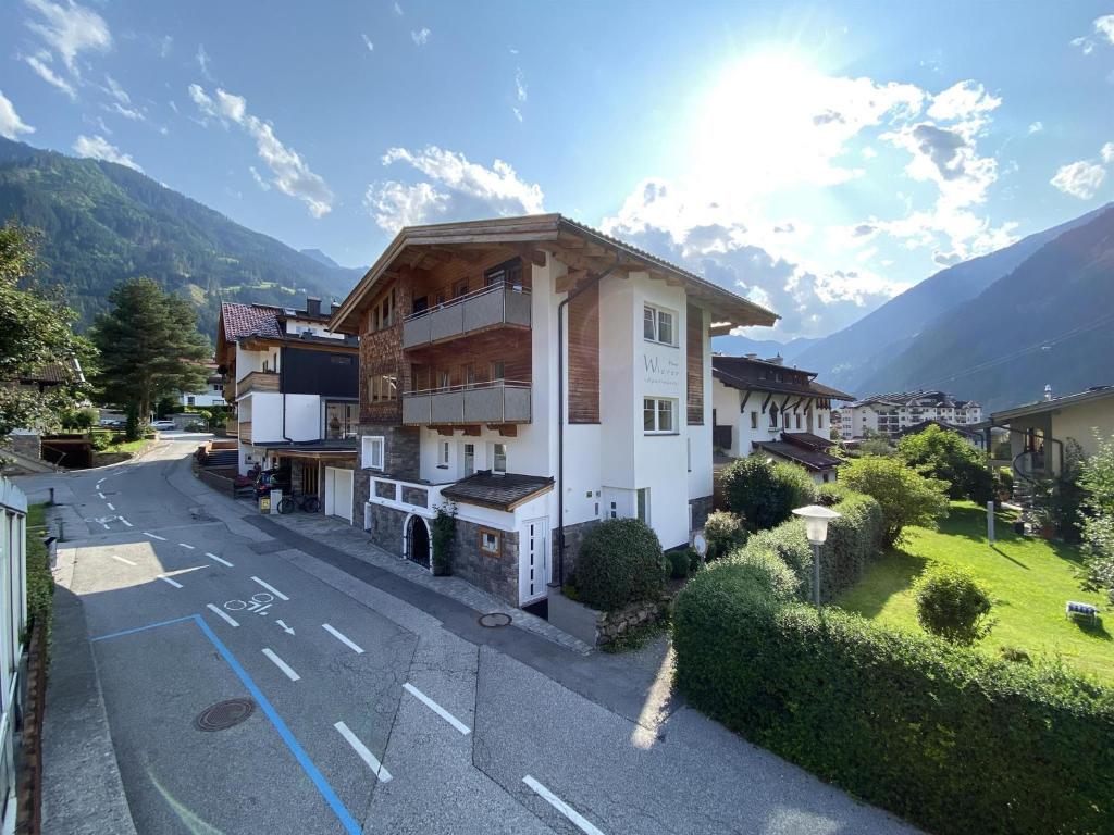 a building on the side of a street with a road at Haus Wierer in Mayrhofen