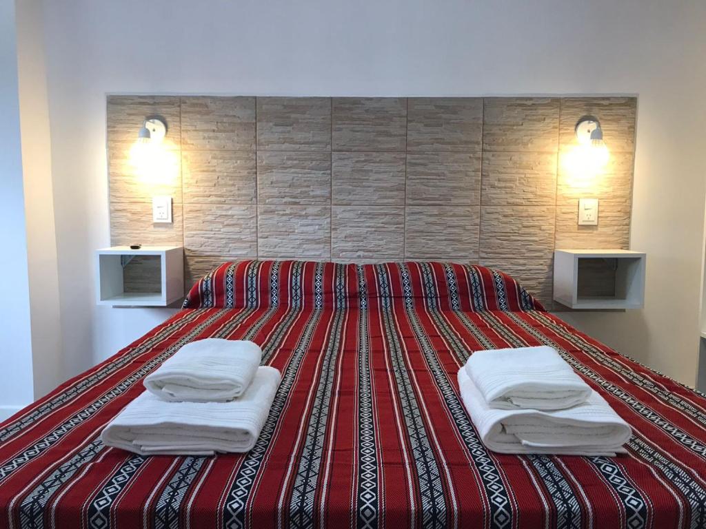 Una cama o camas en una habitación de Guest House Salta