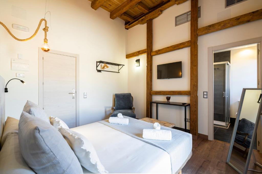 Postel nebo postele na pokoji v ubytování Dobo Azacanes Hostal