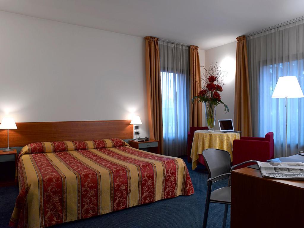 Postel nebo postele na pokoji v ubytování Hotel Filanda